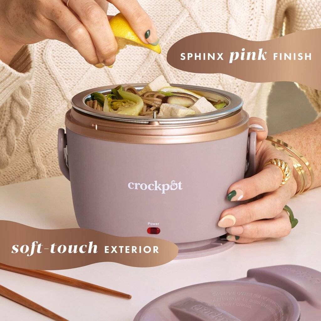 A round, pink Crock-Pot Electric Lunch Warmer on a white desk