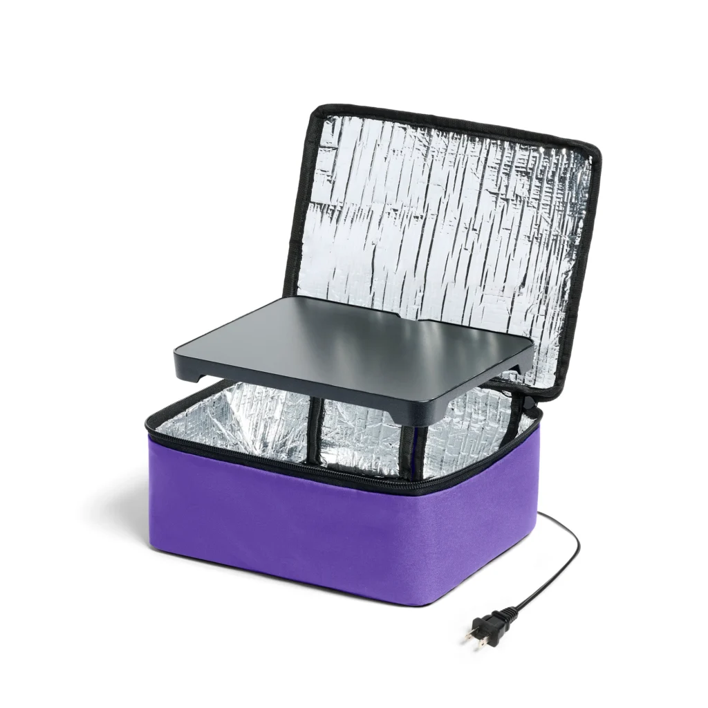 Blue HotLogic Mini Portable Oven closed on a kitchen counter